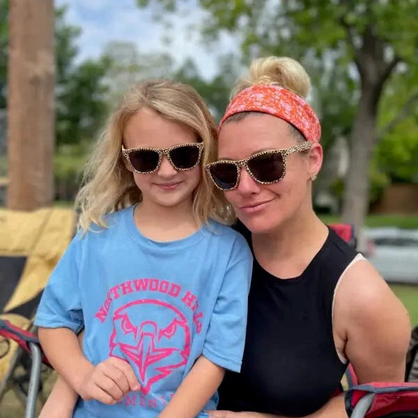 Little girl and mom wearing matching leopard print polarized sunglasses by Sunnies Shades