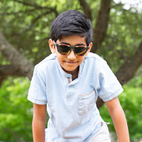 Thumbnail for Boy wearing coral snake printed kids polarized sunglasses by sunnies shades.