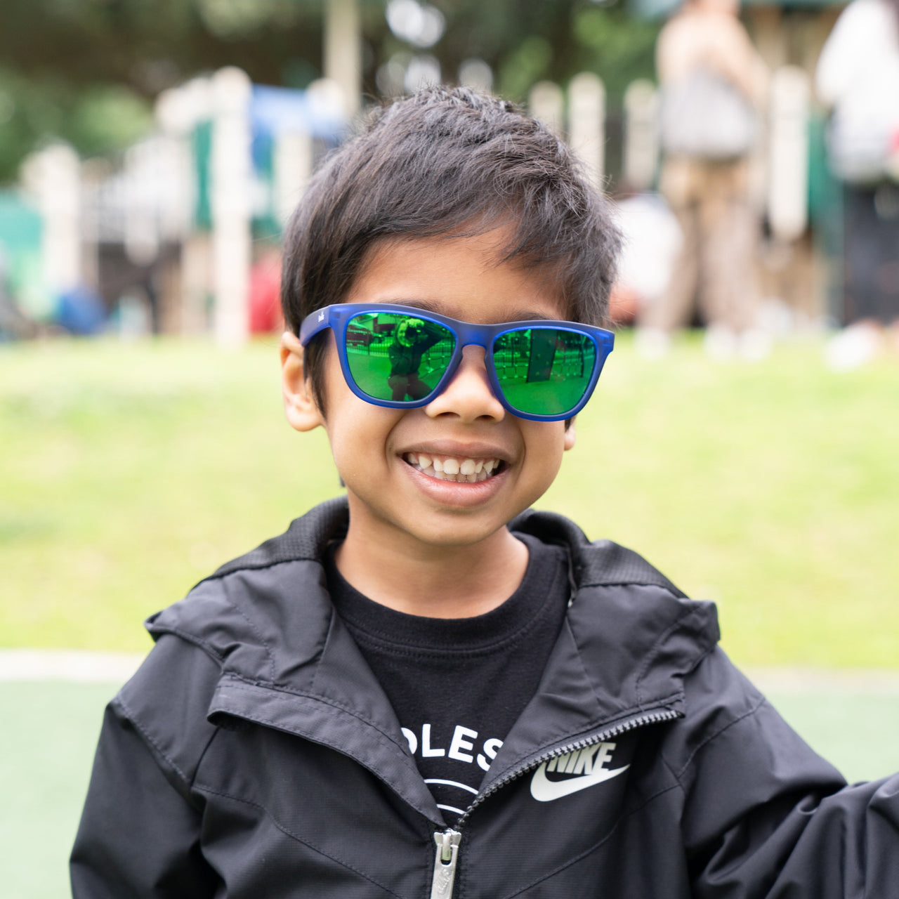 Little boy wearing blue polarized kids sunglasses by sunnies shades