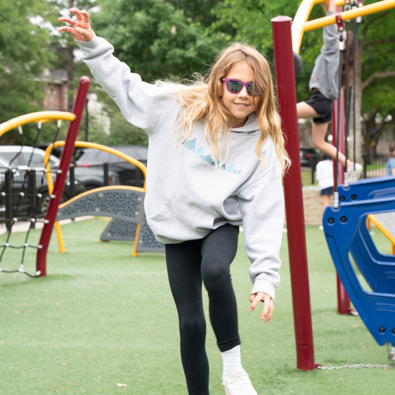 Young girl wearing purple polarized kids sunglasses.